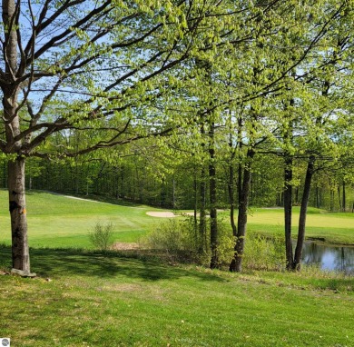 One-bedroom suite, located on the ground level, has relaxing on Cedar River Golf Course in Michigan - for sale on GolfHomes.com, golf home, golf lot