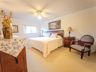 Spacious, sunlit 2-bed, 2-bath corner condo in the sought-after on Flamingo Lakes Country Club in Florida - for sale on GolfHomes.com, golf home, golf lot