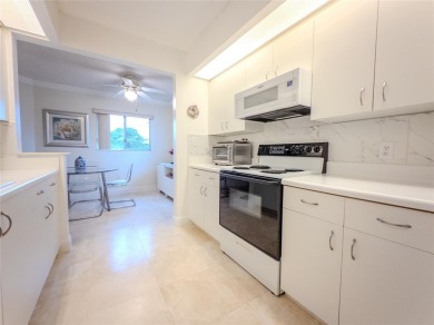 Spacious, sunlit 2-bed, 2-bath corner condo in the sought-after on Flamingo Lakes Country Club in Florida - for sale on GolfHomes.com, golf home, golf lot