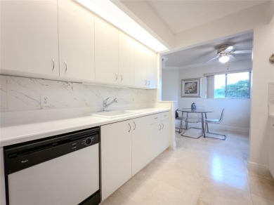 Spacious, sunlit 2-bed, 2-bath corner condo in the sought-after on Flamingo Lakes Country Club in Florida - for sale on GolfHomes.com, golf home, golf lot