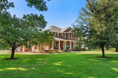 This beautiful all-brick traditional home is situated on a on The Dunes Golf and Beach Club in South Carolina - for sale on GolfHomes.com, golf home, golf lot