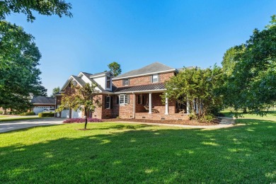 This beautiful all-brick traditional home is situated on a on The Dunes Golf and Beach Club in South Carolina - for sale on GolfHomes.com, golf home, golf lot