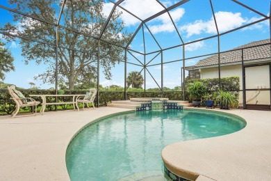 STUNNING POOL HOME WITH SWEEPING GOLF COURSE VIEW IN PGA on PGA Golf Club in PGA Village in Florida - for sale on GolfHomes.com, golf home, golf lot