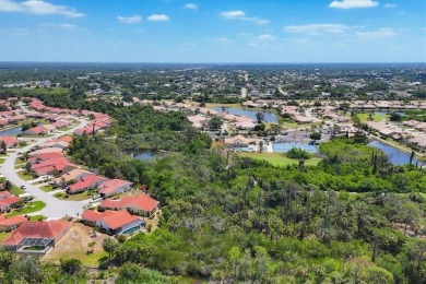 Nestled at the end of a peaceful cul-de-sac in OYSTER CREEK (one on Oyster Creek Golf Club in Florida - for sale on GolfHomes.com, golf home, golf lot