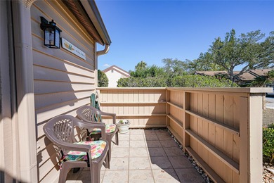 Step into this bright end unit condo with sweeping lake views on Sabal Trace Golf and Country Club in Florida - for sale on GolfHomes.com, golf home, golf lot