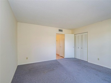 First Floor 1BDR/1BA condo with lake views in active 55+ on The American Golf Club in Florida - for sale on GolfHomes.com, golf home, golf lot