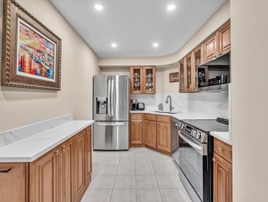 Super stylish kitchen with new quartz countertops, designer on Coral Ridge Country Club in Florida - for sale on GolfHomes.com, golf home, golf lot