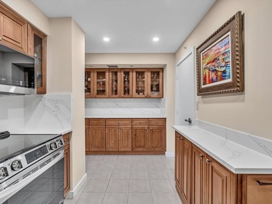Super stylish kitchen with new quartz countertops, designer on Coral Ridge Country Club in Florida - for sale on GolfHomes.com, golf home, golf lot