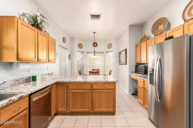 Fall in love with this spacious 3-bed, 2-bath gem featuring a on Coyote Lakes Golf Club in Arizona - for sale on GolfHomes.com, golf home, golf lot