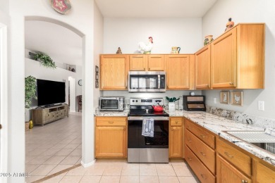 Fall in love with this spacious 3-bed, 2-bath gem featuring a on Coyote Lakes Golf Club in Arizona - for sale on GolfHomes.com, golf home, golf lot