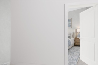 Enjoy elevated coastal living in this top-floor end unit at on Club at Pelican Bay Golf Course in Florida - for sale on GolfHomes.com, golf home, golf lot