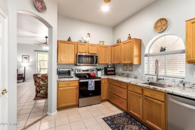 Fall in love with this spacious 3-bed, 2-bath gem featuring a on Coyote Lakes Golf Club in Arizona - for sale on GolfHomes.com, golf home, golf lot