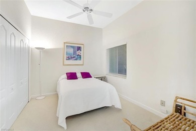 Enjoy elevated coastal living in this top-floor end unit at on Club at Pelican Bay Golf Course in Florida - for sale on GolfHomes.com, golf home, golf lot