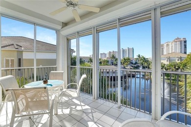 Enjoy elevated coastal living in this top-floor end unit at on Club at Pelican Bay Golf Course in Florida - for sale on GolfHomes.com, golf home, golf lot
