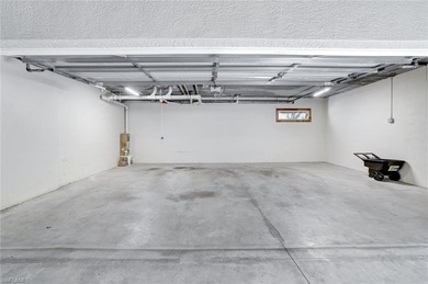 Enjoy elevated coastal living in this top-floor end unit at on Club at Pelican Bay Golf Course in Florida - for sale on GolfHomes.com, golf home, golf lot