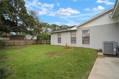 This beautifully maintained single-story home in Lake Padgett on Plantation Palms Golf Club in Florida - for sale on GolfHomes.com, golf home, golf lot