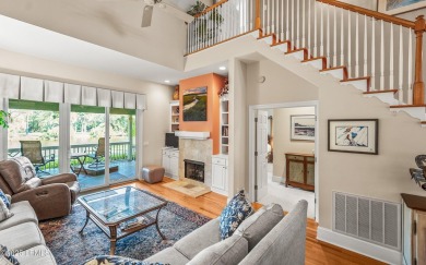Unwind on your screened porch with front-row views of Davis on Ocean Creek Golf Course in South Carolina - for sale on GolfHomes.com, golf home, golf lot