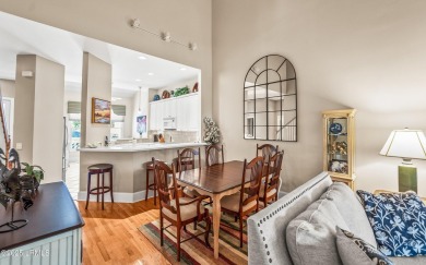 Unwind on your screened porch with front-row views of Davis on Ocean Creek Golf Course in South Carolina - for sale on GolfHomes.com, golf home, golf lot