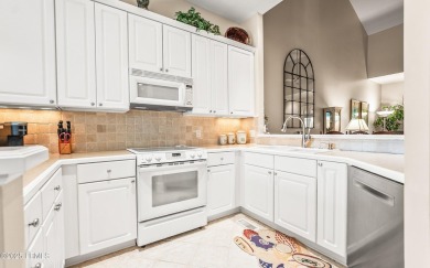 Unwind on your screened porch with front-row views of Davis on Ocean Creek Golf Course in South Carolina - for sale on GolfHomes.com, golf home, golf lot