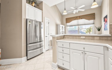 Unwind on your screened porch with front-row views of Davis on Ocean Creek Golf Course in South Carolina - for sale on GolfHomes.com, golf home, golf lot