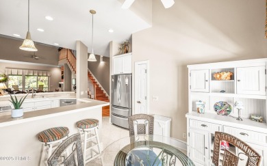 Unwind on your screened porch with front-row views of Davis on Ocean Creek Golf Course in South Carolina - for sale on GolfHomes.com, golf home, golf lot