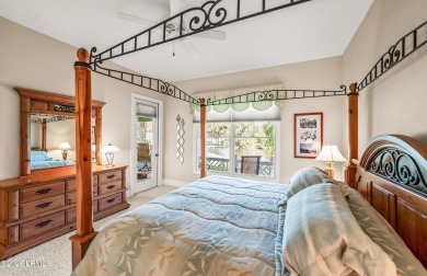 Unwind on your screened porch with front-row views of Davis on Ocean Creek Golf Course in South Carolina - for sale on GolfHomes.com, golf home, golf lot