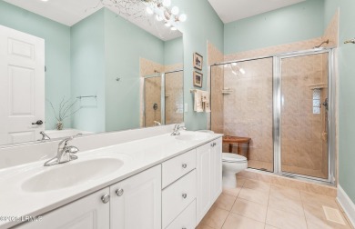 Unwind on your screened porch with front-row views of Davis on Ocean Creek Golf Course in South Carolina - for sale on GolfHomes.com, golf home, golf lot
