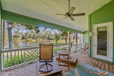 Unwind on your screened porch with front-row views of Davis on Ocean Creek Golf Course in South Carolina - for sale on GolfHomes.com, golf home, golf lot