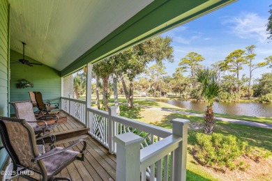 Unwind on your screened porch with front-row views of Davis on Ocean Creek Golf Course in South Carolina - for sale on GolfHomes.com, golf home, golf lot