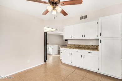 This beautifully refreshed 3-bedroom home in Leisure World, is on Coyote Run Golf Course in Arizona - for sale on GolfHomes.com, golf home, golf lot