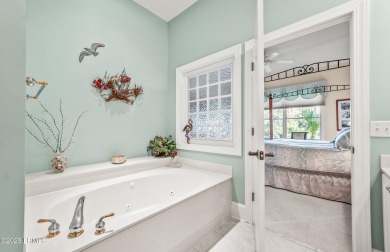 Unwind on your screened porch with front-row views of Davis on Ocean Creek Golf Course in South Carolina - for sale on GolfHomes.com, golf home, golf lot