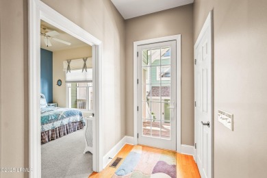 Unwind on your screened porch with front-row views of Davis on Ocean Creek Golf Course in South Carolina - for sale on GolfHomes.com, golf home, golf lot