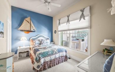 Unwind on your screened porch with front-row views of Davis on Ocean Creek Golf Course in South Carolina - for sale on GolfHomes.com, golf home, golf lot