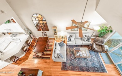 Unwind on your screened porch with front-row views of Davis on Ocean Creek Golf Course in South Carolina - for sale on GolfHomes.com, golf home, golf lot