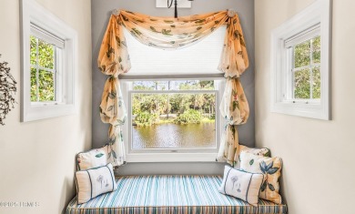 Unwind on your screened porch with front-row views of Davis on Ocean Creek Golf Course in South Carolina - for sale on GolfHomes.com, golf home, golf lot