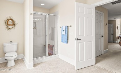 Unwind on your screened porch with front-row views of Davis on Ocean Creek Golf Course in South Carolina - for sale on GolfHomes.com, golf home, golf lot