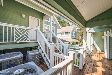 Unwind on your screened porch with front-row views of Davis on Ocean Creek Golf Course in South Carolina - for sale on GolfHomes.com, golf home, golf lot