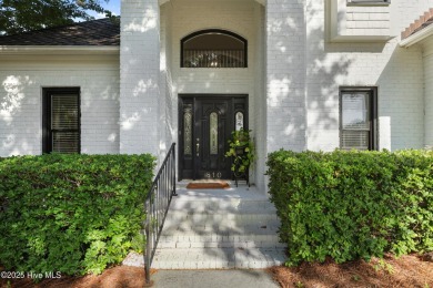 Elegant 4BR/2.5BA brick home in Landfall with private pond views on Country Club of Landfall in North Carolina - for sale on GolfHomes.com, golf home, golf lot