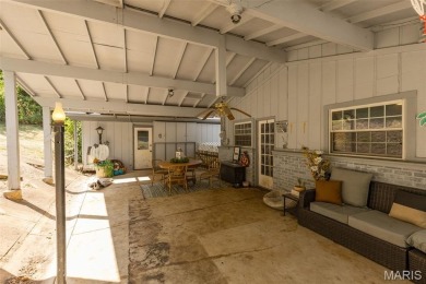 Unique and full of charm, this home sits on four lots totaling 2 on Terre Du Lac Golf and Country Club in Missouri - for sale on GolfHomes.com, golf home, golf lot