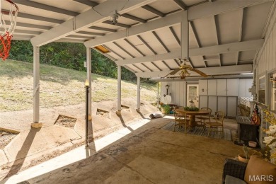 Unique and full of charm, this home sits on four lots totaling 2 on Terre Du Lac Golf and Country Club in Missouri - for sale on GolfHomes.com, golf home, golf lot