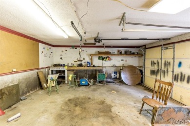 Unique and full of charm, this home sits on four lots totaling 2 on Terre Du Lac Golf and Country Club in Missouri - for sale on GolfHomes.com, golf home, golf lot