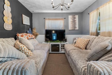Unique and full of charm, this home sits on four lots totaling 2 on Terre Du Lac Golf and Country Club in Missouri - for sale on GolfHomes.com, golf home, golf lot