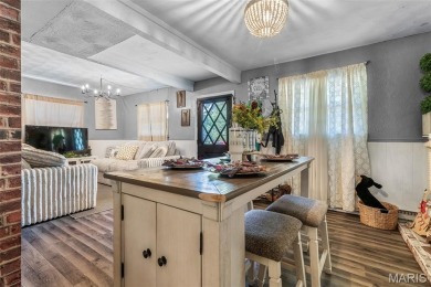 Unique and full of charm, this home sits on four lots totaling 2 on Terre Du Lac Golf and Country Club in Missouri - for sale on GolfHomes.com, golf home, golf lot