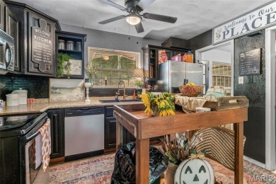 Unique and full of charm, this home sits on four lots totaling 2 on Terre Du Lac Golf and Country Club in Missouri - for sale on GolfHomes.com, golf home, golf lot