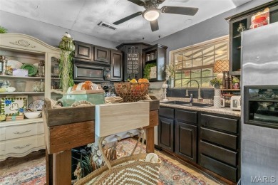 Unique and full of charm, this home sits on four lots totaling 2 on Terre Du Lac Golf and Country Club in Missouri - for sale on GolfHomes.com, golf home, golf lot