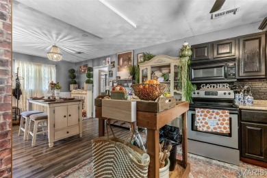 Unique and full of charm, this home sits on four lots totaling 2 on Terre Du Lac Golf and Country Club in Missouri - for sale on GolfHomes.com, golf home, golf lot