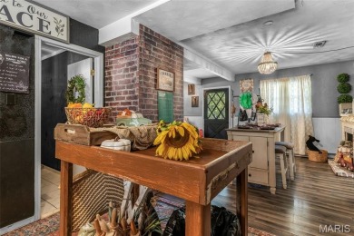 Unique and full of charm, this home sits on four lots totaling 2 on Terre Du Lac Golf and Country Club in Missouri - for sale on GolfHomes.com, golf home, golf lot