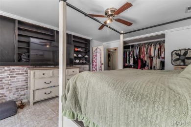 Unique and full of charm, this home sits on four lots totaling 2 on Terre Du Lac Golf and Country Club in Missouri - for sale on GolfHomes.com, golf home, golf lot