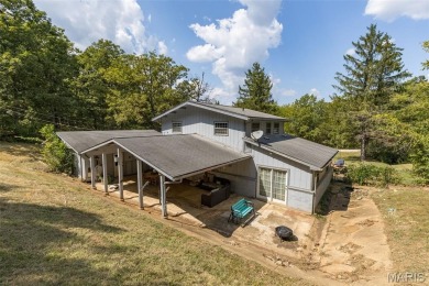 Unique and full of charm, this home sits on four lots totaling 2 on Terre Du Lac Golf and Country Club in Missouri - for sale on GolfHomes.com, golf home, golf lot
