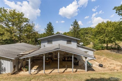Unique and full of charm, this home sits on four lots totaling 2 on Terre Du Lac Golf and Country Club in Missouri - for sale on GolfHomes.com, golf home, golf lot